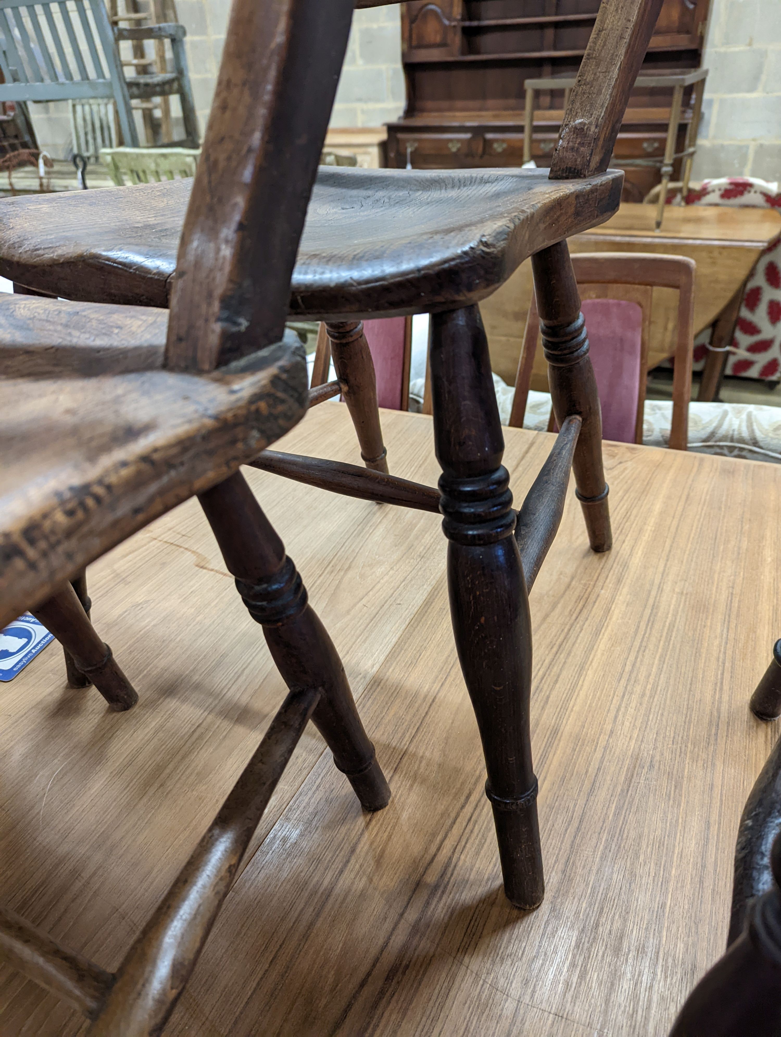 A pair of Victorian Windsor elm and beech kitchen chairs. H-83cm.